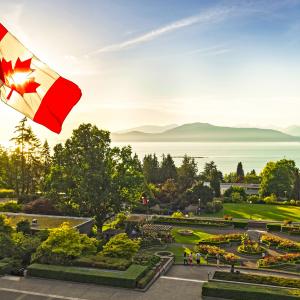 Photo of Canadian flag overlooking UBC campus